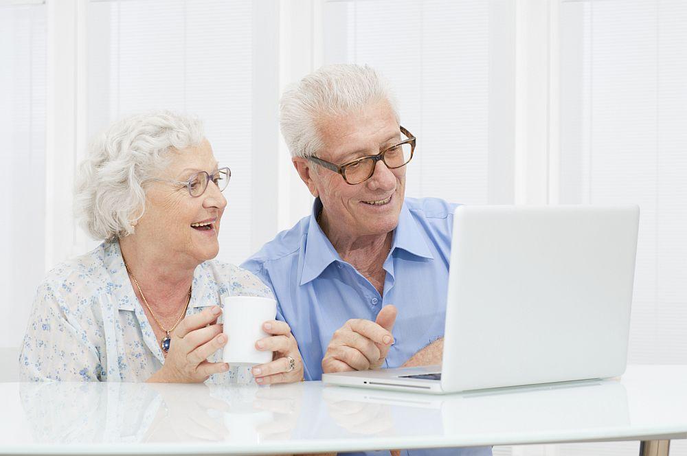 Elders working with computer